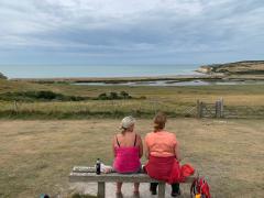 Pausing for chocolate chip brioches, overlooking Cuckmere Haven